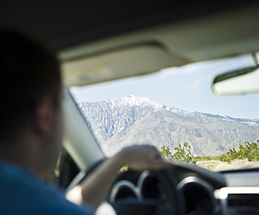 USA, California, Palm Springs, Coachella Valley, San Gorgonio Pass, Close up of man inside car