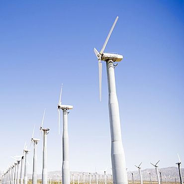 USA, California, Palm Springs, Coachella Valley, San Gorgonio Pass, Wind turbines against blue sky