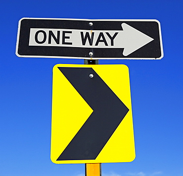 One Way and arrow street signs