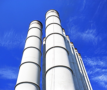Low angle view of industrial silos