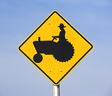 farmer on tractor sign