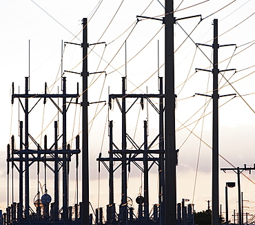 Low angle view of power lines on poles