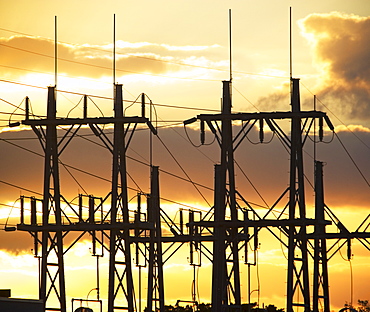 Low angle view of power lines on poles