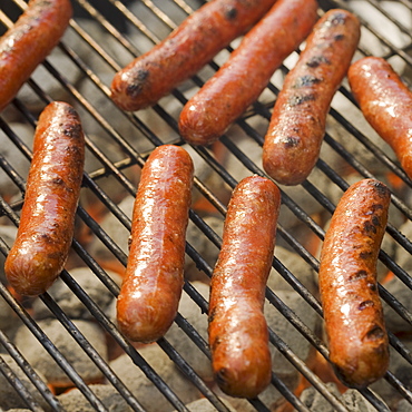 Hot dogs cooking on grill