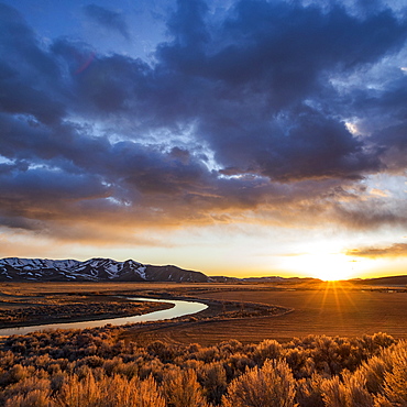 USA, Idaho, Picabo, Sunset over plain and mountain range