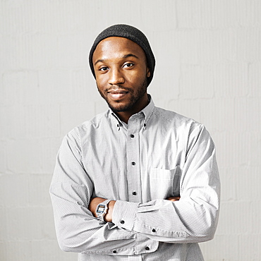 Close up portrait of smiling Black man wearing stocking-cap