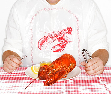 Man eating a lobster