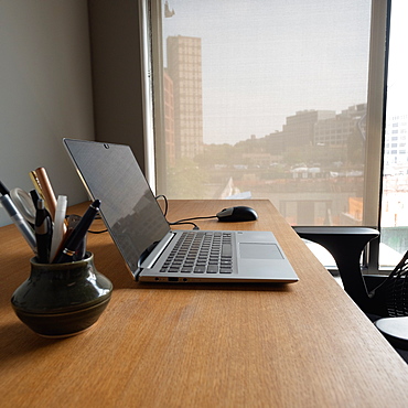 Open laptop on business desk