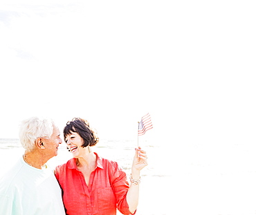 Couple celebrating Fourth of July on beach, Jupiter, Florida