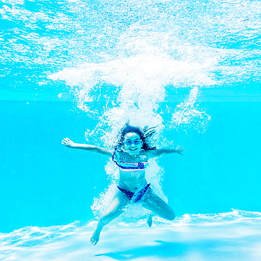 girl ( 8-9) swimming