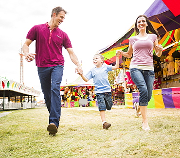 Happy Family and son (4-5) in amusement park, USA, Utah, Salt Lake City 