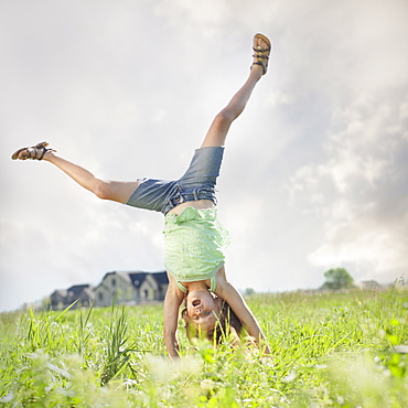 Young girl doing cartwheel