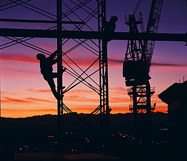 Workers climbing towers of construction site in Las Vegas