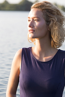 Beautiful woman standing in lake