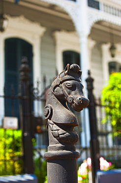 Iron statue of a horse's head on top of a post