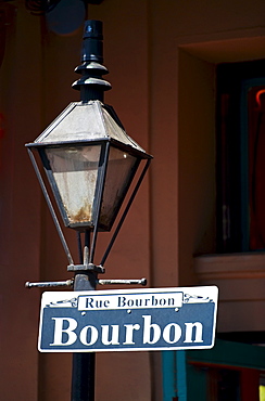 Lamp post and Bourbon Street sign in New Orleans