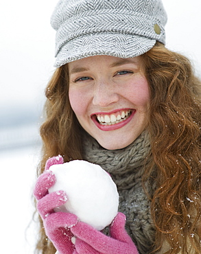 Woman holding a snowball