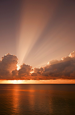 Sunset behind clouds