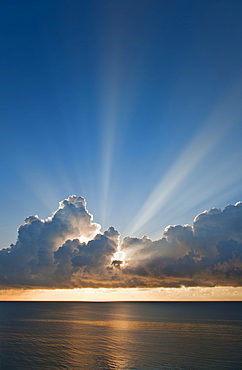 Sunset behind clouds