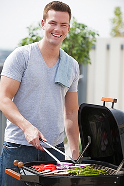 Man barbequing