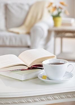 Coffee and book on table