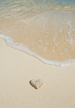 Heart shaped sand on beach