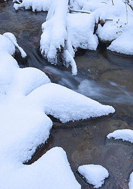 Snowy stream in winter
