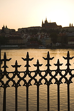 Silhouetted fence post and river