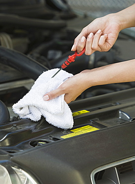 Mechanic checking oil