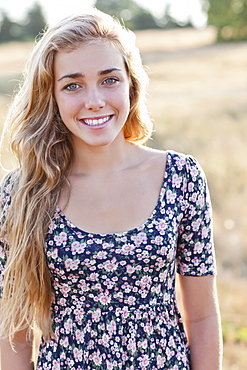 Outdoor portrait of happy teenage girl (16-17) 