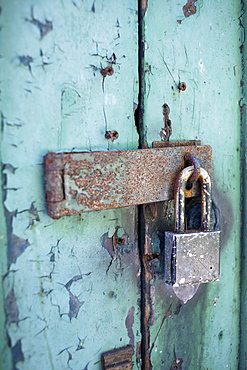 Old rusty padlock on door