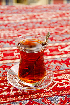 Turkey, Istanbul, glass of tea on table