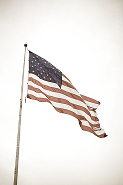 USA, Pennsylvania, American flag flying on mast