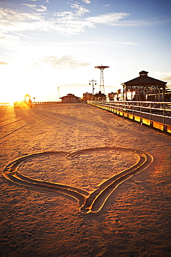 USA, New York City, Coney Island, heart shape in sand