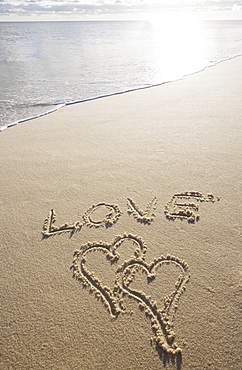 USA, Massachusetts, love sign with heart shapes on sand