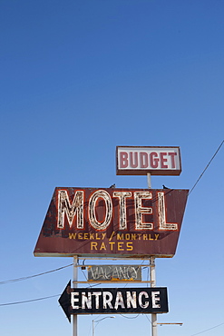 USA, Arizona, Winslow, Old-fashioned motel sign against blue sky