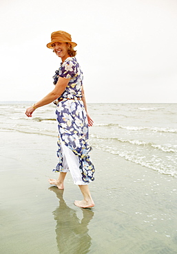 Woman walking on the beach