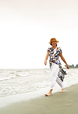 Woman walking on the beach