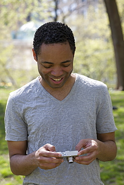 Man looking at photograph on digital camera