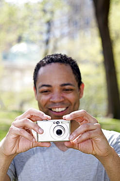 Man taking photograph in Central Park