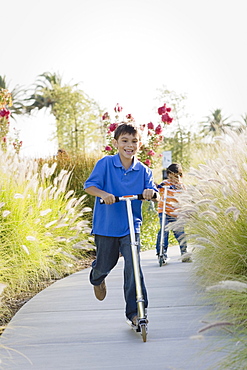 Children riding scooters