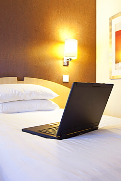 Laptop on bed