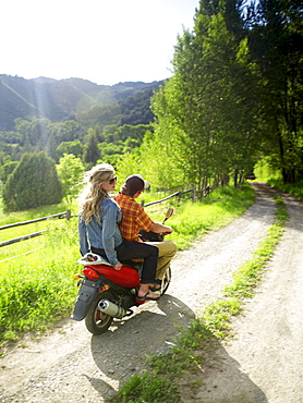 Young couple on scooter