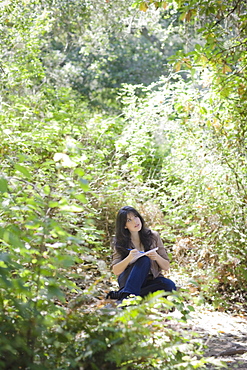 Young female in forest