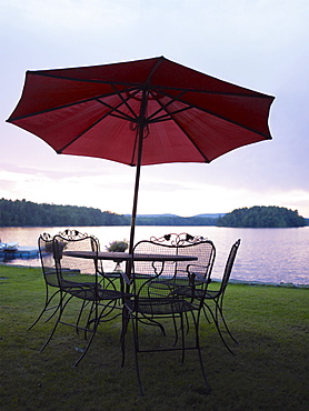 A patio set by a lake