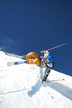 A downhill skier doing a trick