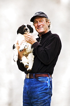 Man holding puppy