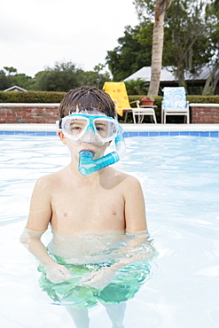 Boy snorkeling in swimming pool