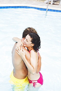 Couple hugging in swimming pool