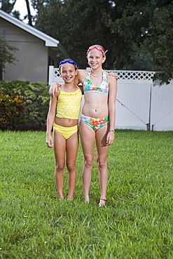 Girls posing on lawn